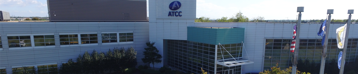 ATCC headquarters building and "ATCC" sign and flags in Manassas, Virginia.