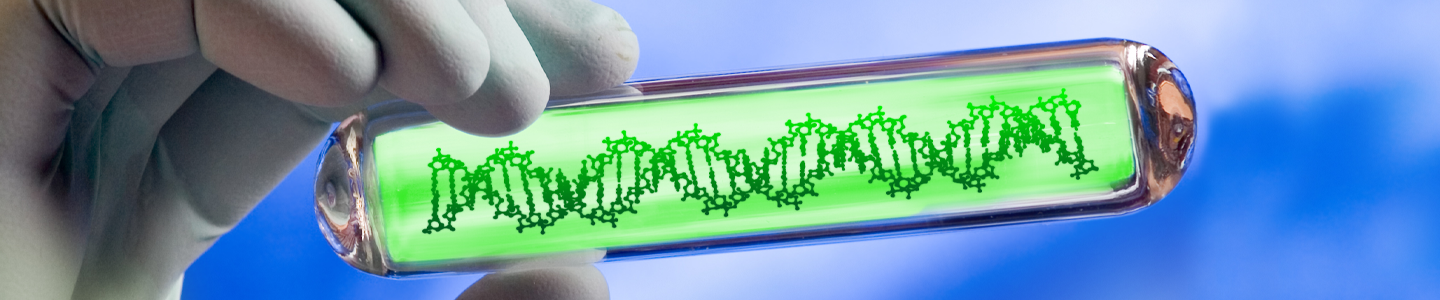 Hand holding clear tube that contains DNA strand in neon green substance.
