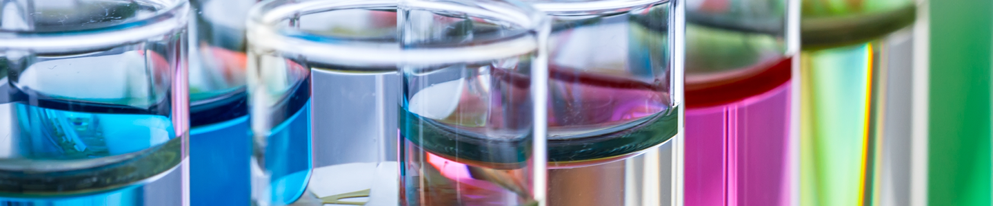 Rows of test tubes containing liquid of various colors.