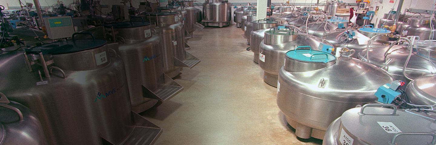 Large room full of liquid nitrogen cryopreservation tanks at biorepository.