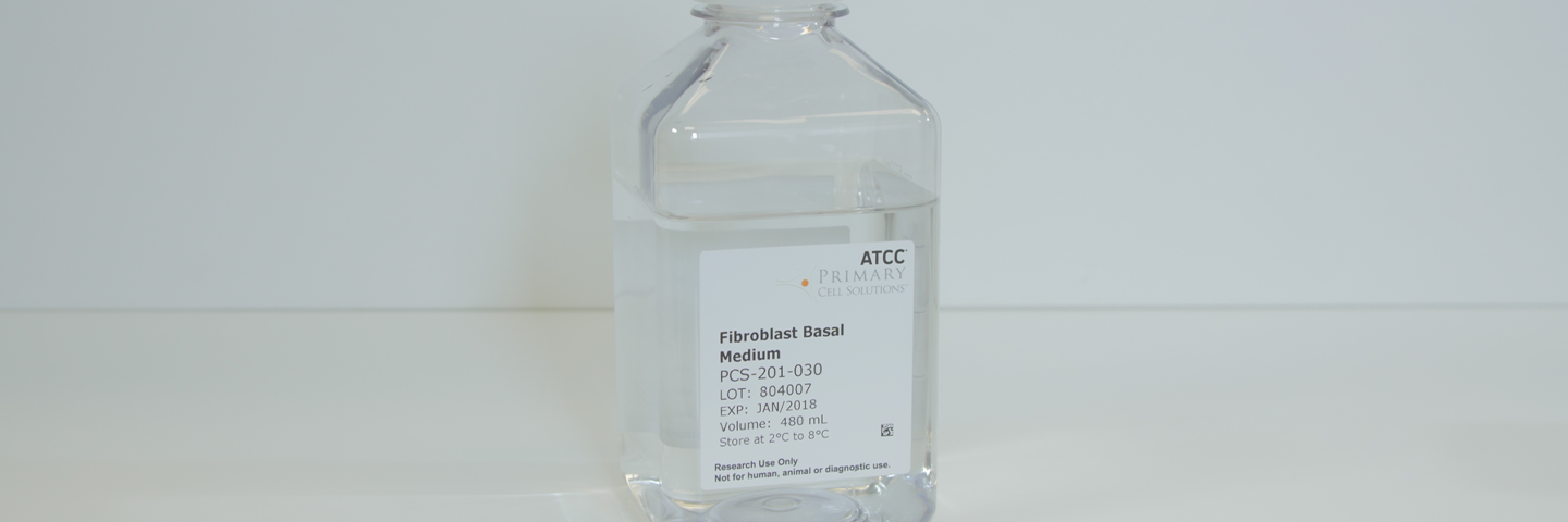 Capped clear bottle containing clear media, labeled Fibroblast Basal Medium PCS-201-030.