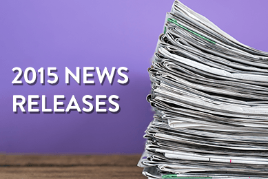 Stack of newspapers with text  on a purple background that says 2015 News Releases.