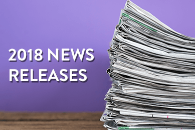 Stack of newspapers with text  on a purple background that says 2018 News Releases.
